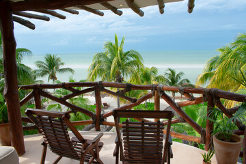 Lounge chairs on the balcony overlooking the beach in Holbox Mexico 