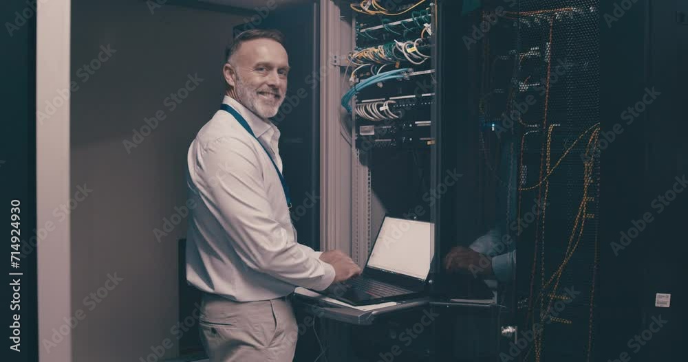 Poster Portrait of mature man in server room with laptop, network maintenance and engineer in digital storage for update. Tech, system administration and happy technician online in data center with computer