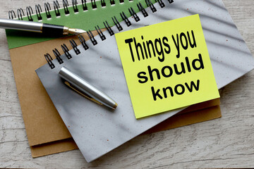 'Things you should know'. gray notepad on the table. text on page