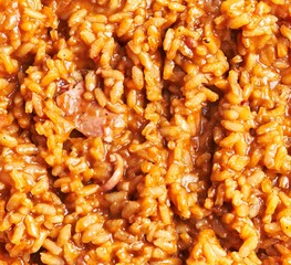 Close-up of creamy risotto with mushrooms, a classic italian dish, perfect for culinary backgrounds.