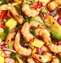 Close-up of succulent shrimp ceviche with ripe mango, fresh cilantro, and diced onion, embodying vibrant tropical flavors.