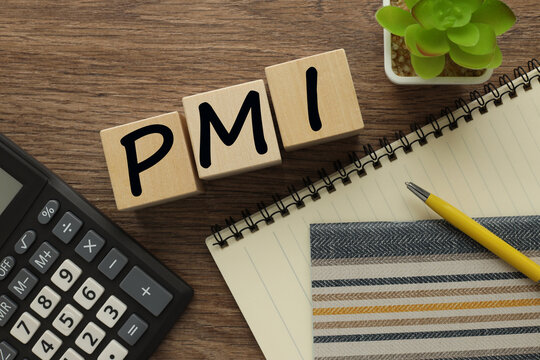 PMI - acronym from wooden blocks with letters, Purchasing Managers Index. Global economy concept