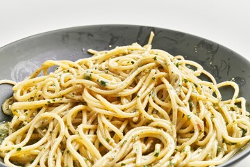  Delicious plate of italian spaghetti pasta with sauce over isolated white background