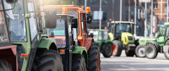 Farmers blocked traffic with tractors during a protest - obrazy, fototapety, plakaty