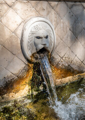 Old venetian fountain with lions heads in Spili, Crete island, Greece - 714937597