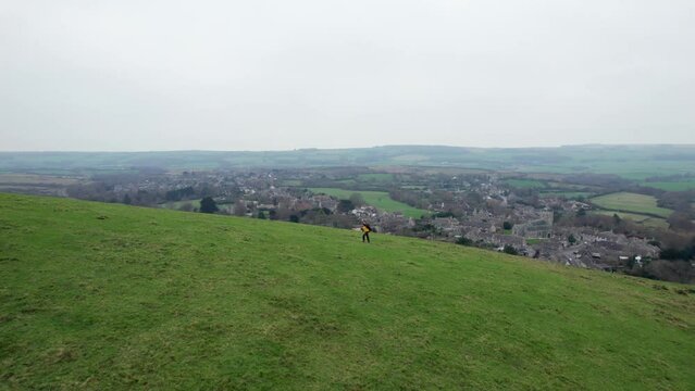 HIking walking near the Corfe Castle, the famous historical site and the village, united kingdom.. Overcast day.