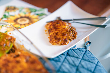 Finished lasagna added to plate.