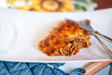 Finished lasagna added to plate.