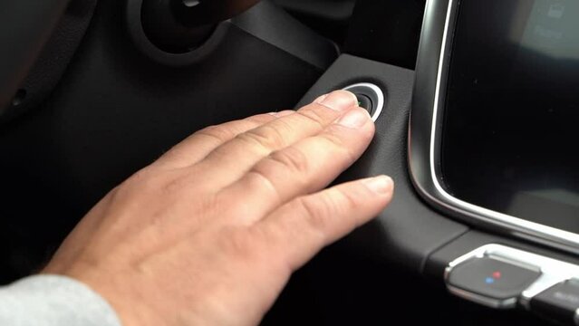 the driver starts the car with the start stop button