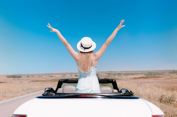 Happy woman sitting on passenger seat in car