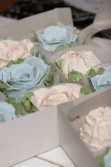 Marshmallows in open gift boxes. Zephyr fir cones and Zephyr flowers. Homemade Zephyr.