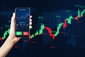 Close up of businesswoman hand holding mobile phone with glowing forex chart on dark background. Trade, stock and finance concept.
