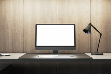 Contemporary office setup with computer and desk lamp on wooden background. Minimalist design concept. 3D Rendering