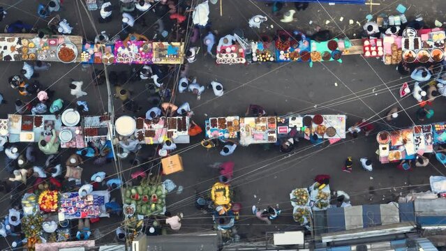 Vibrant celebration of Ramadan in Dhaka's Chalkbazar through this mesmerizing aerial view of the lively hustle and bustle of the Iftar food market.