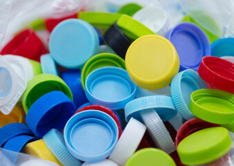 Colourful of plastic caps made from polypropylene or PP grade that can recycle and environmentally friendly. spot focus.
