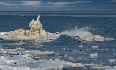 Russia. The western coast of Sakhalin Island. Picturesque ice floes of the spring Pacific Ocean.