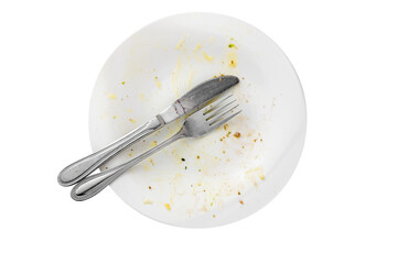 Empty dirty food plate with knife and fork isolated, table top view