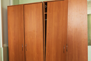 natural lighting. room. a broken wooden cabinet door