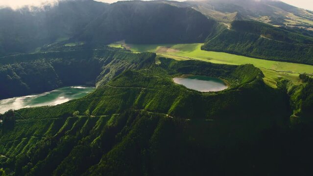 Aerial shot, drone point of view, Boca do Inferno. Picturesque lakes in volcanoes craters. San Miguel, Ponta Delgada island, Azores, Portugal. Bird eye view. Landmarks and natural wonders concept 