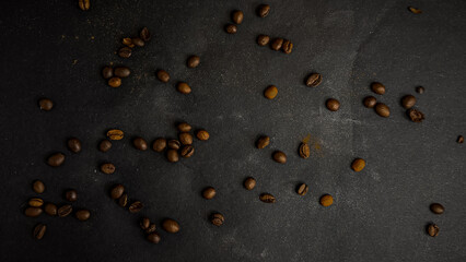 Roasted coffee beans falling on black background, Concept for coffee product advertising, Selective focus, place for text.