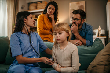 A family trusting a skilled home nurse to provide professional care for their child