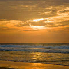 Tropical beach, sea and bright sunset.