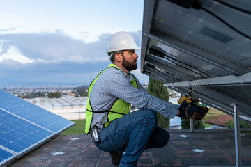 engineer installing and giving maintenance to solar panels, concept of renewable energy power, professional technician working below solar panel, beneath power station