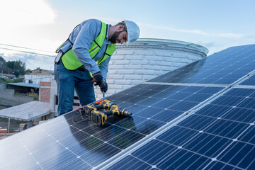 young engineer working using different tools, technician installing a solar panel using a rattle...