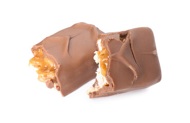 Pieces of tasty chocolate bar with nougat on white background