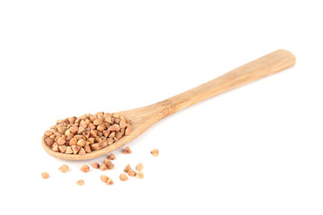 Spoon with raw buckwheat isolated on white