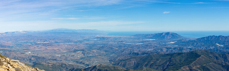 Panoramic view on Mediterranean sea and Malaga from the Torrecilla peak, Sierra de las Nieves national park, Andalusia, Spain