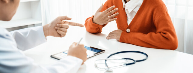 Patient attend doctor's appointment at clinic or hospital office, discussing medical treatment...