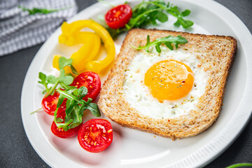 Fototapeta na wymiar fried egg bread toast scrambled yolk protein delicious breakfast hearty food fresh delicious healthy eating cooking appetizer meal food snack on the table