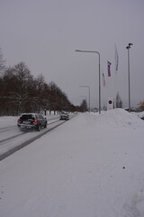 Winter Finnish roads with beautiful trees, white tracks with cars covered with ice and snow in Varkaus, Finland.