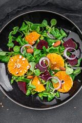 citrus salad, beet, green leaf lettuce fresh healthy eating meal food snack on the table copy space food background top view