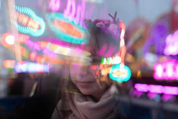 young cosplay woman on fun fare and Ferris wheel with magic winter lights - obrazy, fototapety, plakaty