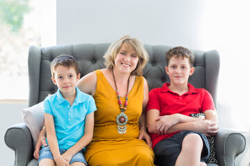 Mid-age woman with two boys indoor