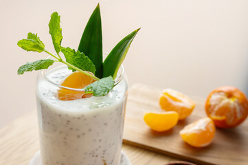 Close-up of pudding from chia seeds and yogurt or milk with clementine.