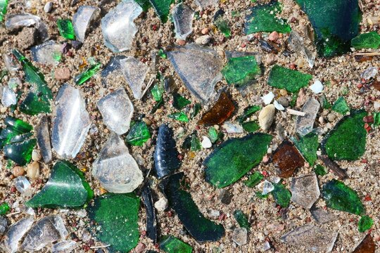 Colorful shards of broken glass lying on the ground.