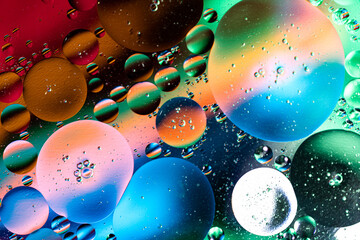 colorful light and water drops on glass, breathtaking view created by light and water. Macro photography.