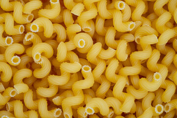 Close-Up of Uncooked Cavatappi Pasta Background