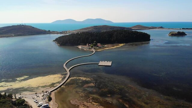 Drone aerial view on isolated Monastery of Saint Mary on Zvernec island Narta Lagoon, Vlore, Albania
