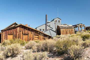Fototapeta na wymiar Deserted sliver mining operation building in Bodie State Park Ghost Town in the desert landscape of California. 