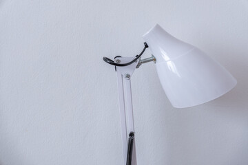 White table lamp on a white background, minimalism style