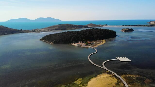 Drone aerial view on isolated Monastery of Saint Mary on Zvernec island Narta Lagoon, Vlore, Albania