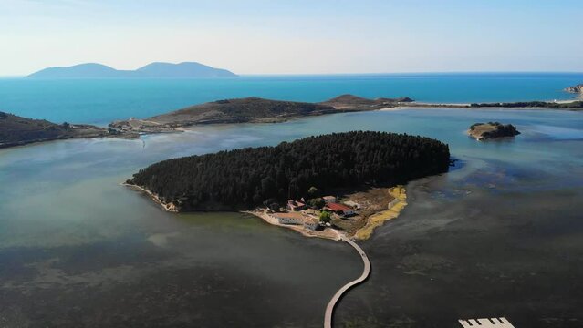 Drone aerial view on isolated Monastery of Saint Mary on Zvernec island Narta Lagoon, Vlore, Albania
