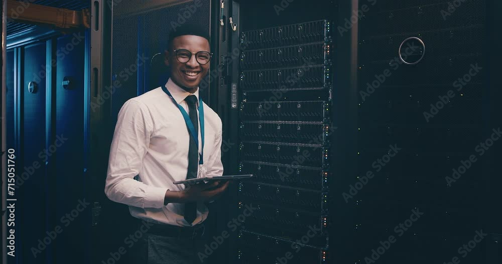 Poster portrait of black man in data center with tablet, inspection or network maintenance with engineer in