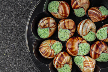 snails with green oil aromatic herbs tasty fresh healthy eating cooking appetizer meal food snack on the table copy space food background