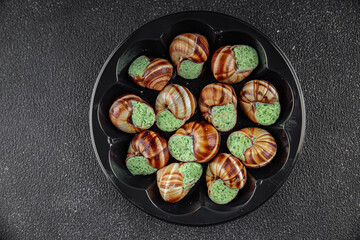 snails with green oil aromatic herbs tasty fresh healthy eating cooking appetizer meal food snack on the table copy space food background