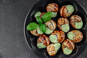 snails with green oil aromatic herbs tasty fresh healthy eating cooking appetizer meal food snack on the table copy space food background